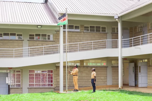 PCEA Enoomatasiani Booth Boys High School - scouts raising the flag at the parade ground