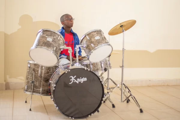 PCEA Enoomatasiani Booth Boys High School - student playing drum sets