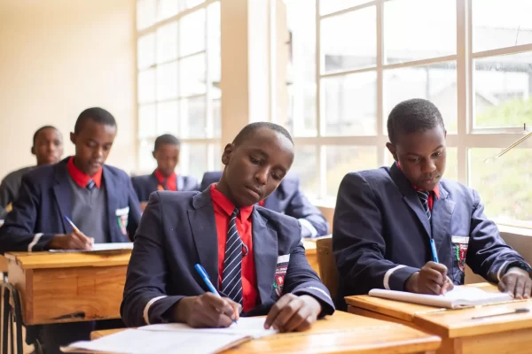 PCEA Enoomatasiani Booth Boys High School - students discussing in class