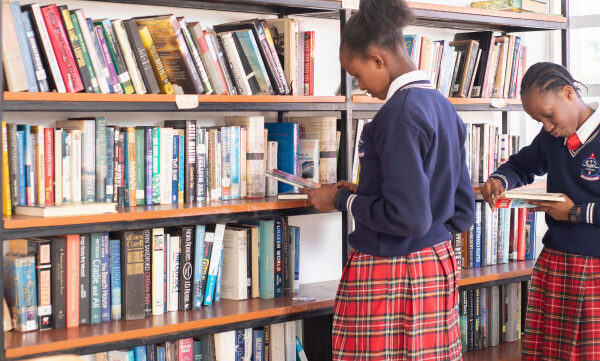 PCEA Ongata Booth Girls High School students in the library reading through books