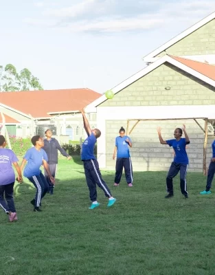 PCEA Ongata Booth Girls High School students playing at the field