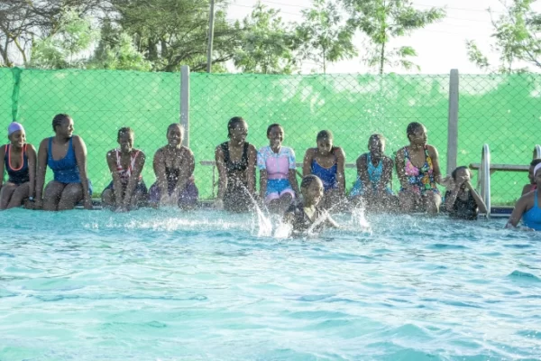 Booth Foundation schools of excellence girls swimming during a swimming competition