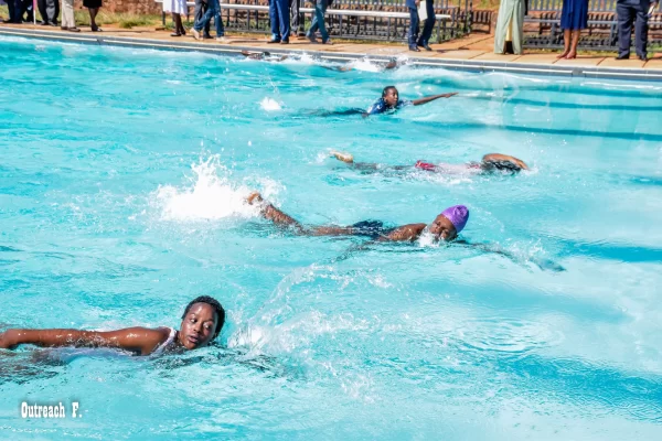 Booth Foundation schools of excellence girls swimming during a swimming competition